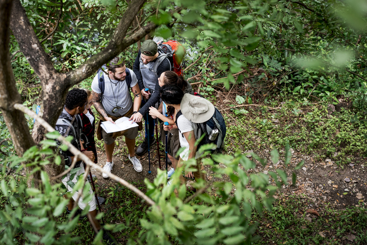 trekking together in a forest